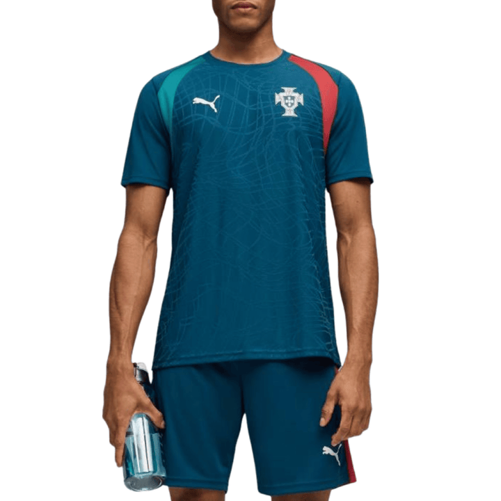 Men's teal polyester soccer jersey with red and green accents by Puma