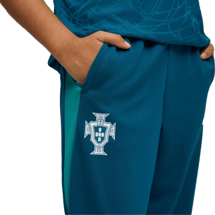 Teal athletic pants with Portugal national team logo and side pockets for casual wear.