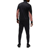 Back view of man wearing black and pink PSG Champions League tracksuit from SoccerTracksuits.com