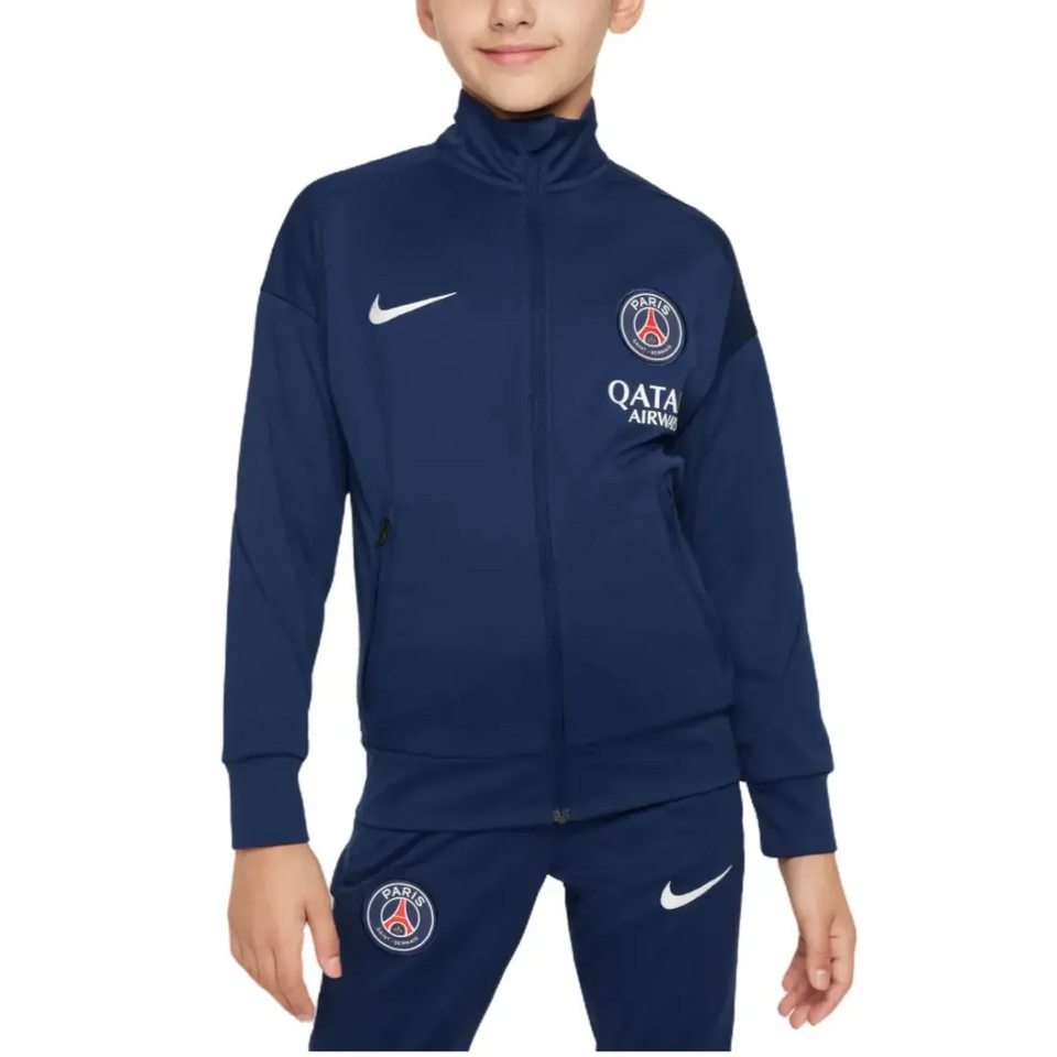 PSG navy blue kids presentation tracksuit featuring zip pockets and logo for young fans
