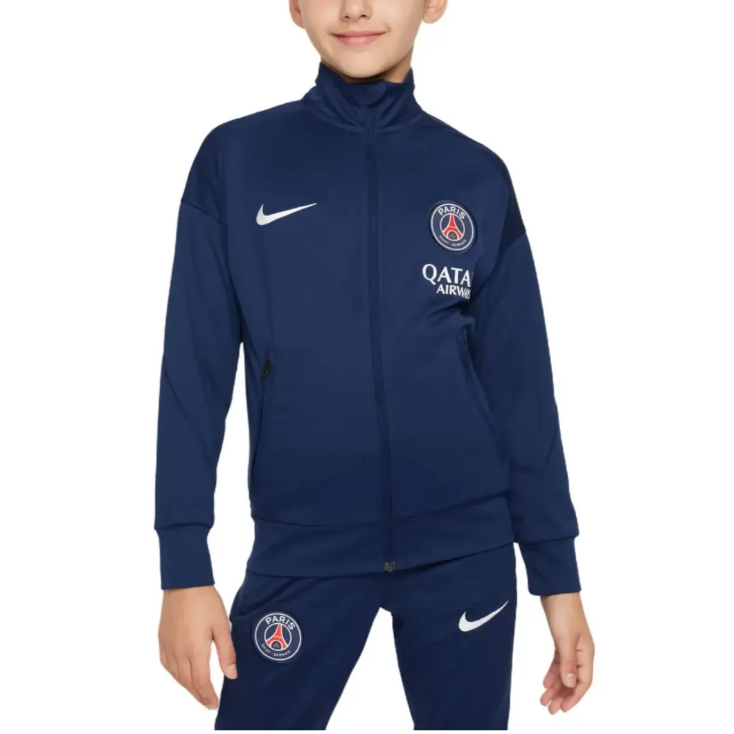 PSG navy blue kids presentation tracksuit featuring zip pockets and logo for young fans