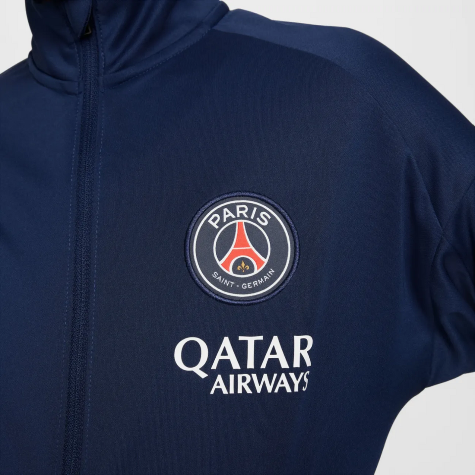 PSG navy blue kids presentation tracksuit featuring Paris Saint-Germain logo and Qatar Airways branding