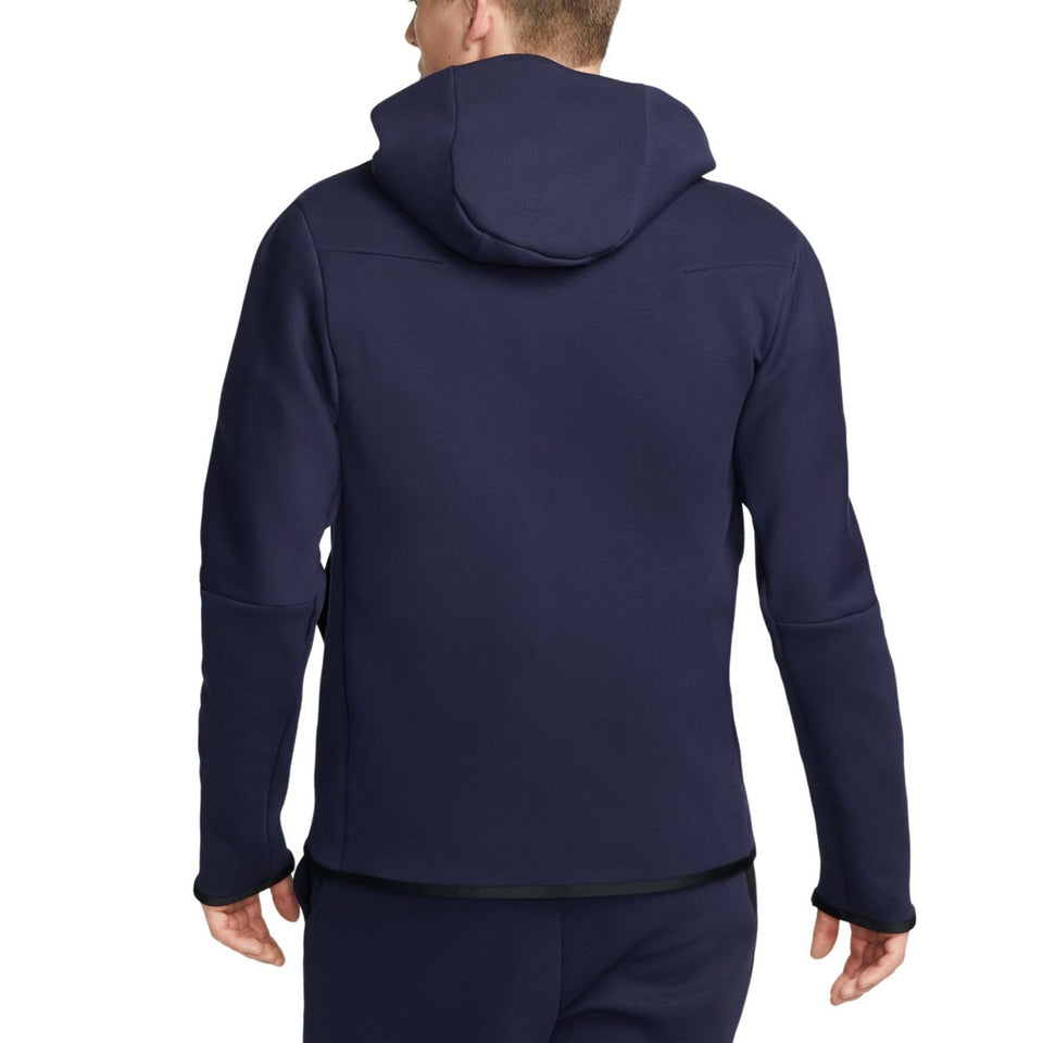Back view of navy blue PSG tech fleece tracksuit 2023 hoodie and pants worn by a male model