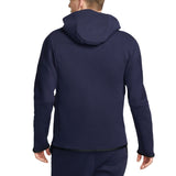Back view of navy blue PSG tech fleece tracksuit 2023 hoodie and pants worn by a male model