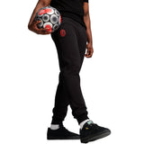 Black tracksuit pants with AC Milan logo holding soccer ball AC Milan fan apparel 2024 25