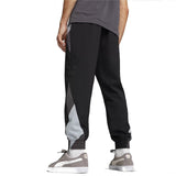 Back view of Puma BVB woven presentation suit black pants with gray accents worn by a male model