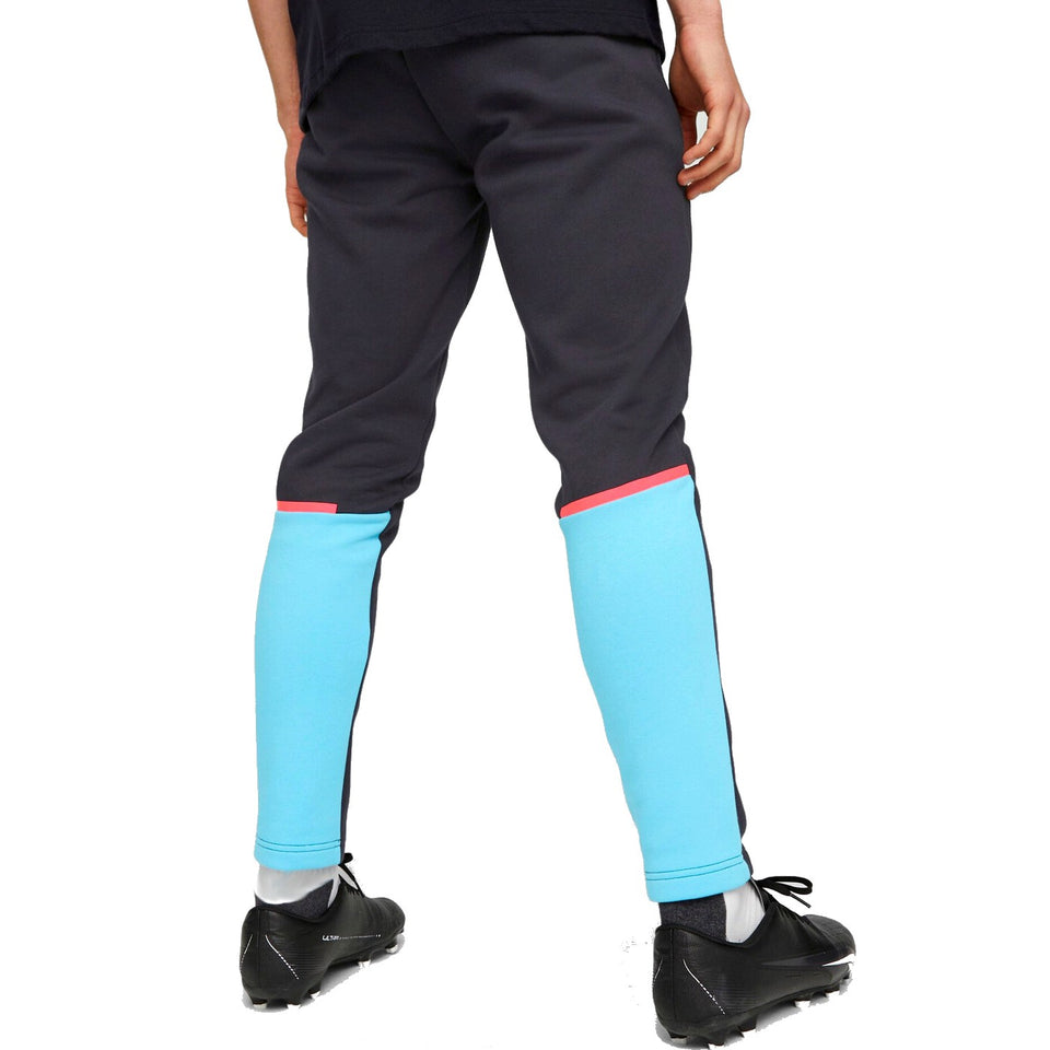 Back view of Puma Man City hooded tracksuit black pants with blue and pink accents worn with black cleats