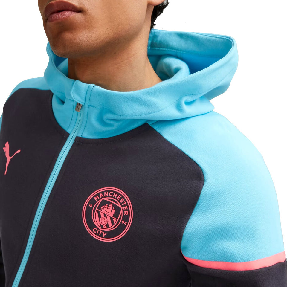 Puma Man City hooded tracksuit in black and blue with pink Manchester City logo and Puma branding