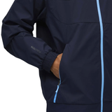Close-up of Puma Manchester City presentation tracksuit featuring a navy jacket with light blue zipper and cuffs