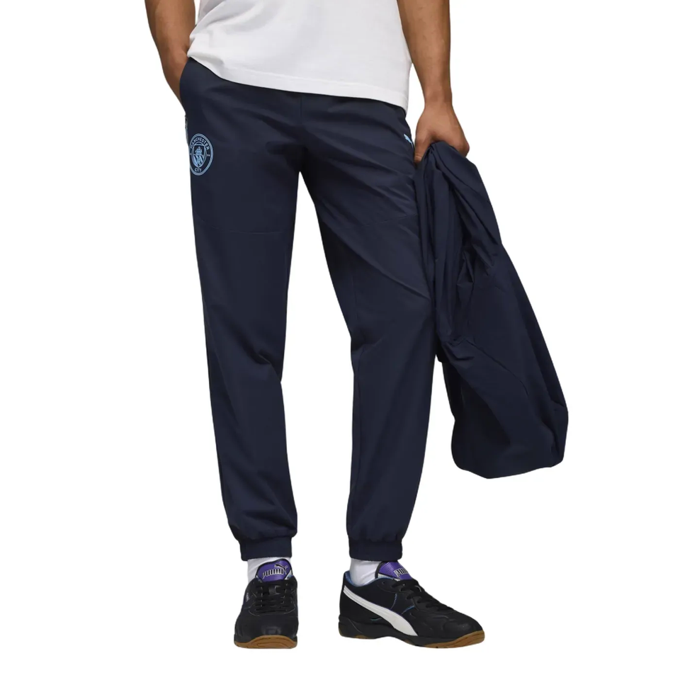 Puma Manchester City presentation tracksuit featuring sleek design and comfortable fit for fans