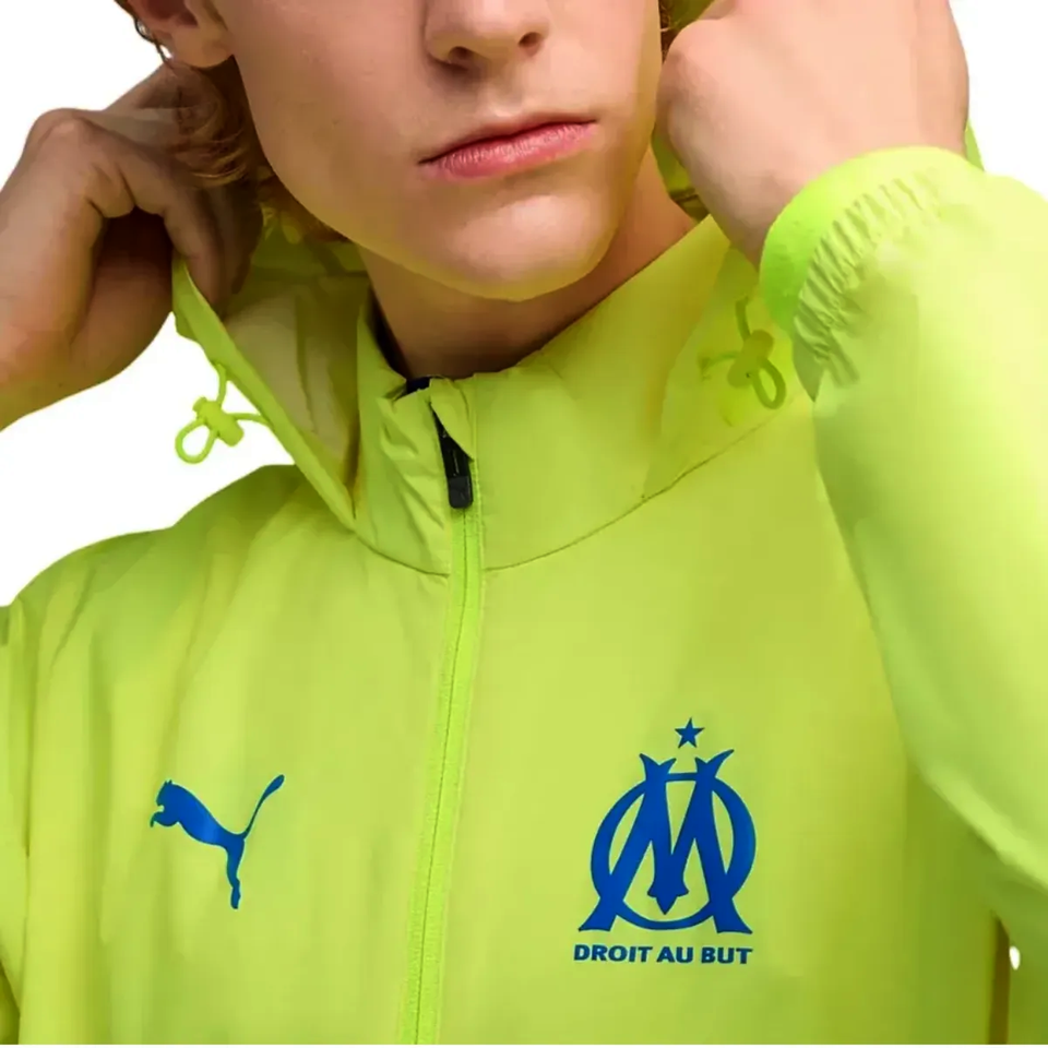 Bright yellow Olympique Marseille rain jacket 2025 with logo and zipper for sports enthusiasts