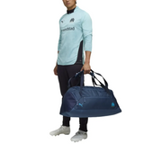 Olympique Marseille training tracksuit 2025 26 with a light blue top and navy bag for training sessions