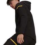 Male model wearing Puma Borussia Dortmund jacket black hoodie with yellow trim part of soccer tracksuit