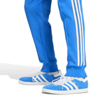 Blue Adidas Originals tracksuit 2025 with iconic stripes and matching shoes for real Madrid fans