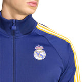 Blue tracksuit with yellow stripes and Real Madrid logo on a white background