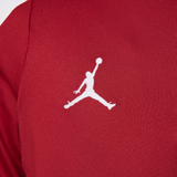 Close-up of the red Jordan PSG training tracksuit for kids featuring the iconic Jordan logo