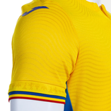 Romania national team jersey Joma in yellow with emblem and striped details on the sleeves