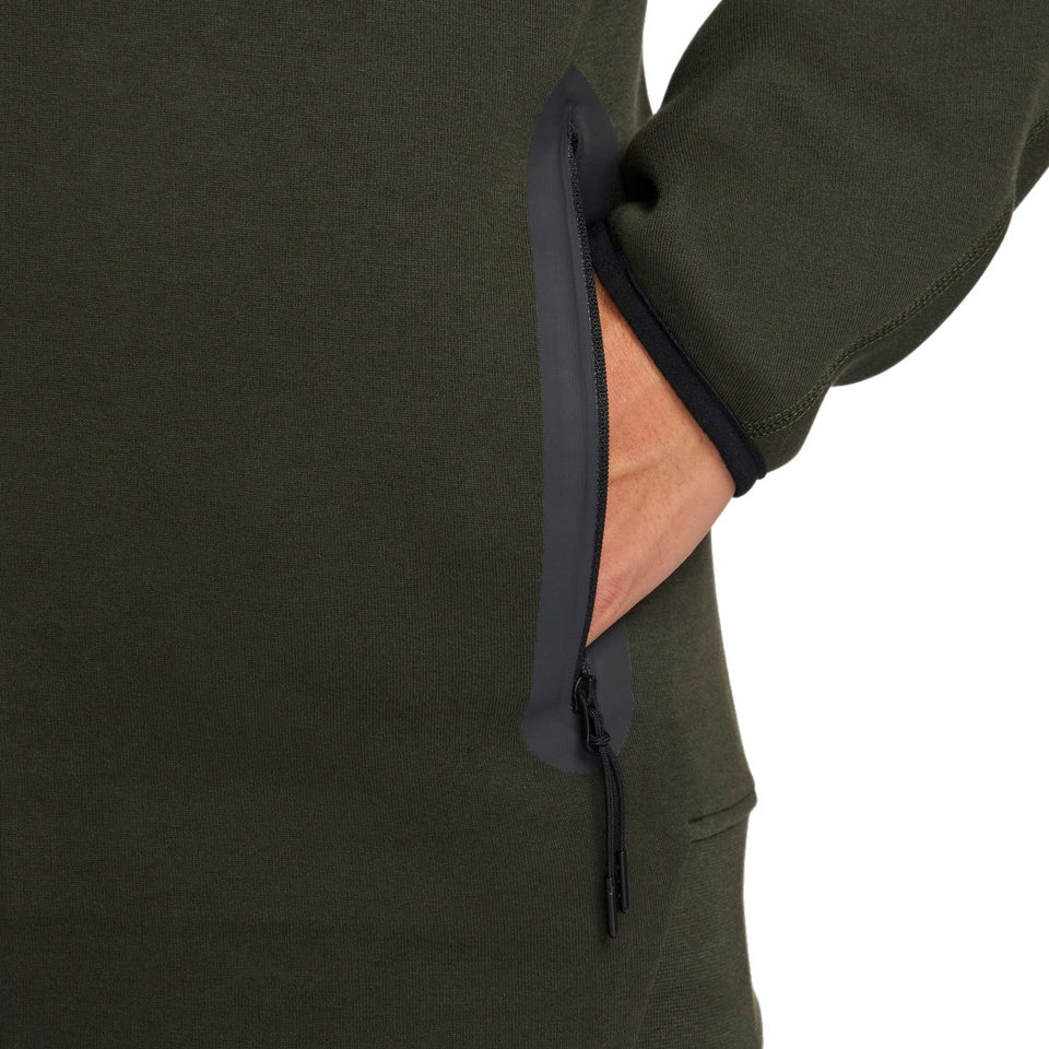 Close-up of olive green Tottenham Hotspur Nike Tech Fleece tracksuit zipper pocket detail on sleeve