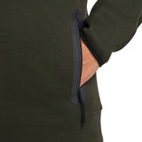 Close-up of olive green Tottenham Hotspur Nike Tech Fleece tracksuit zipper pocket detail on sleeve