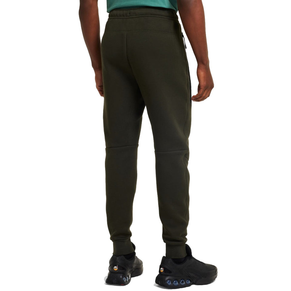 Back view of a man wearing black pants from the Tottenham Hotspur Nike Tech Fleece tracksuit