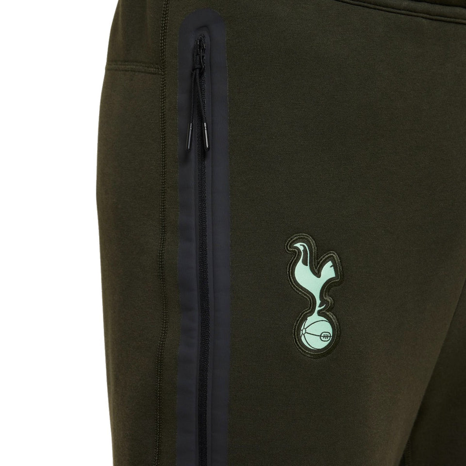 Close-up of Tottenham Hotspur Nike Tech Fleece tracksuit pants with club logo and zippered pocket