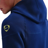 Close-up of navy hoodie featuring Nike logo, part of the Tottenham Hotspur UCL Tech Fleece tracksuit