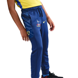 Youth model wearing Tottenham Hotspur youth tracksuit 2025 26 featuring club logo and breathable material