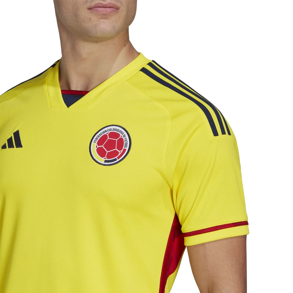 Colombia home soccer jersey 2022 in yellow with red and blue accents from SoccerTracksuits.com