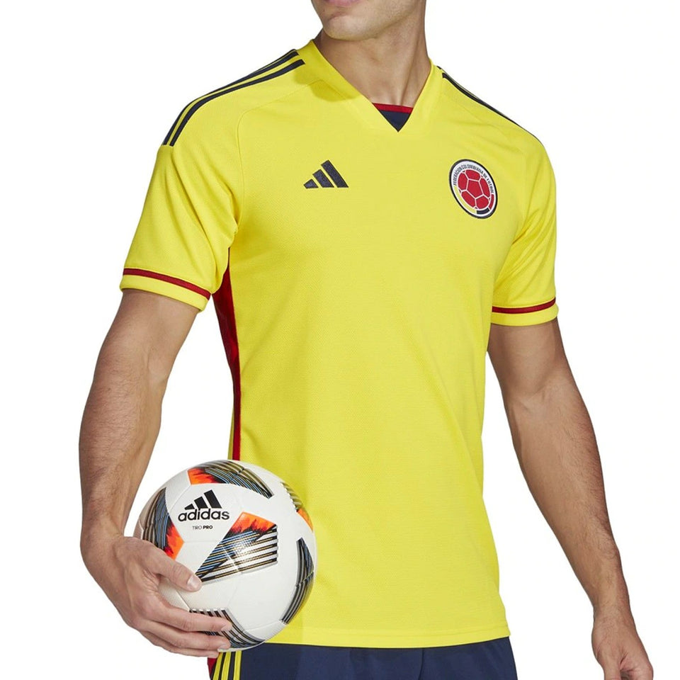 Colombia home soccer jersey 2022 in vibrant yellow with red and blue accents