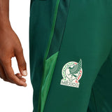 Close-up of green Mexico soccer tracksuit 2022 pants with emblem and detailed stitching