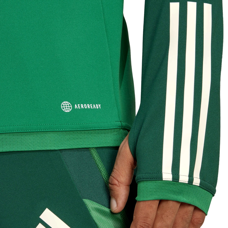 Close-up of green Mexico soccer tracksuit 2022 sleeve and pants with white stripes and Aeroready fabric