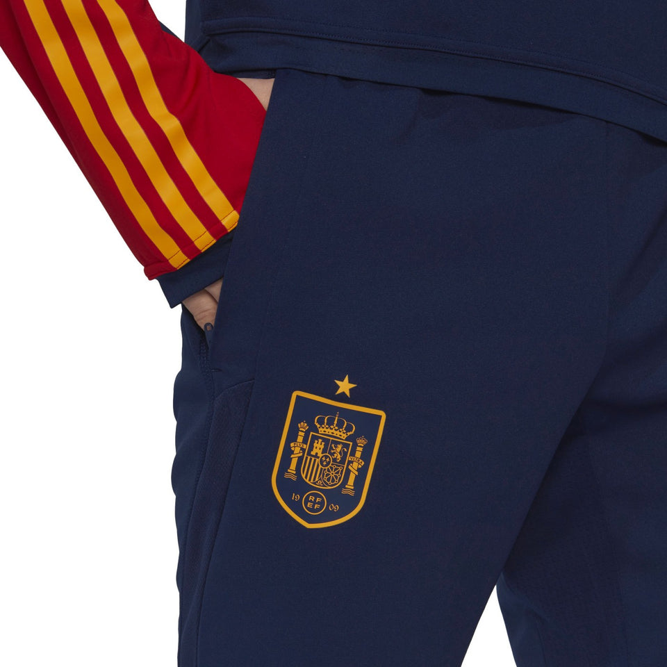 Adidas Spain training tracksuit navy 2022 showcasing Spain emblem and vibrant red and yellow sleeves