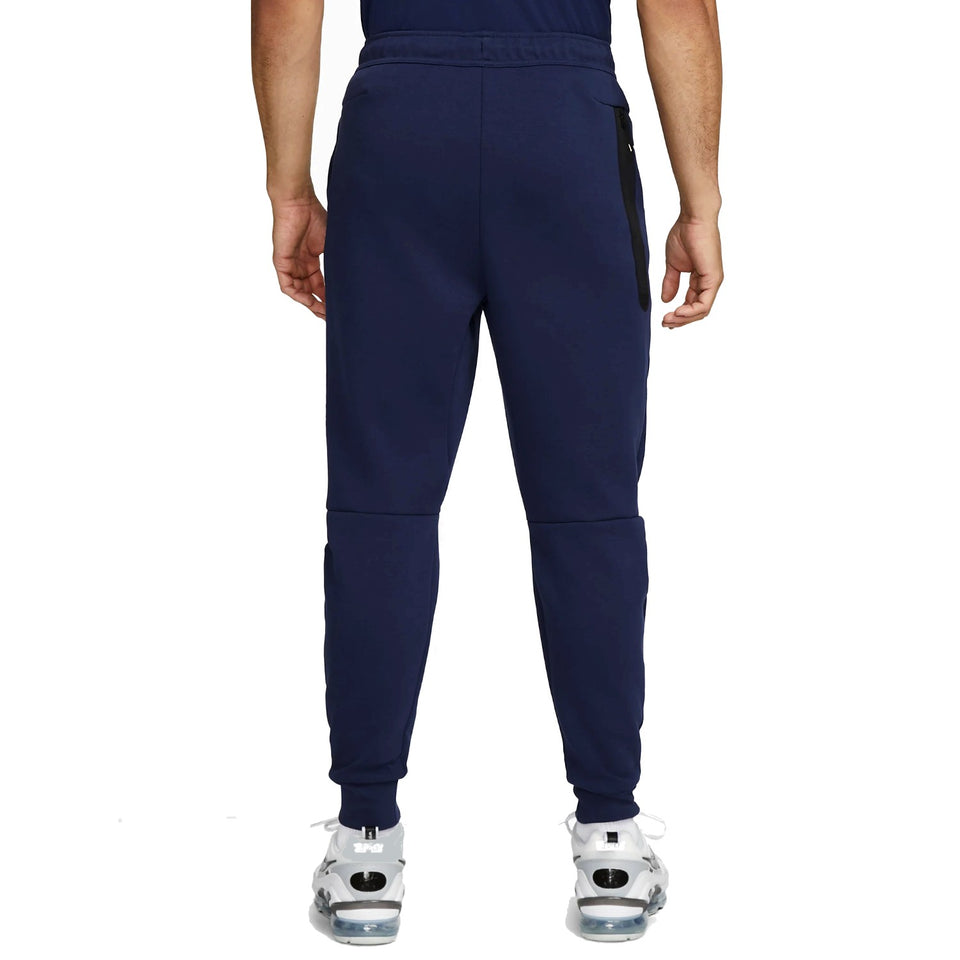 Back view of navy blue France Tech fleece tracksuit 2022 featuring tapered legs and side pockets