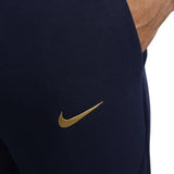 Close-up of Nike logo on navy blue France Tech fleece tracksuit 2022, showcasing premium fabric and design