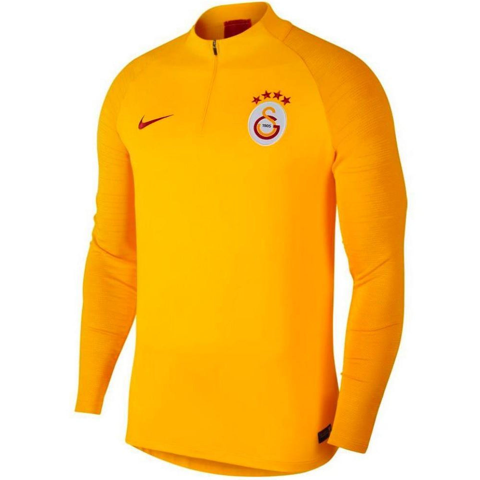 Galatasaray Nike training tracksuit featuring a vibrant yellow long-sleeve top with team logo