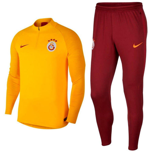 Galatasaray Nike training tracksuit featuring a yellow top and red pants for optimal performance