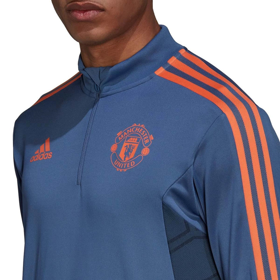 Manchester United training tracksuit 2022 23 with blue design and orange accents from SoccerTracksuits.com