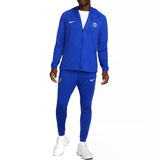 Blue Nike PSG soccer tracksuit with zip-up jacket and pants modeled for casual athletic wear buy Nike PSG soccer tracksuit online