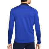 Back view of man wearing blue Chelsea training tracksuit 2022 2023 top with black collar and textured sleeves