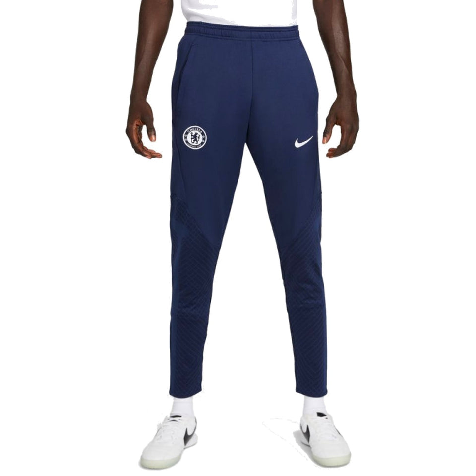 Men wearing navy blue Chelsea training tracksuit 2022 2023 pants with Chelsea and Nike logos