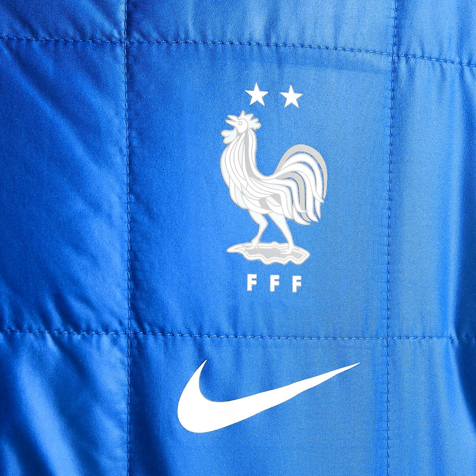 Close-up of the Nike France bomber jacket 2022 with emblem and logo details in vibrant blue