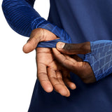 Close-up of hands adjusting the sleeves of the Nike France training tracksuit 2022 in blue