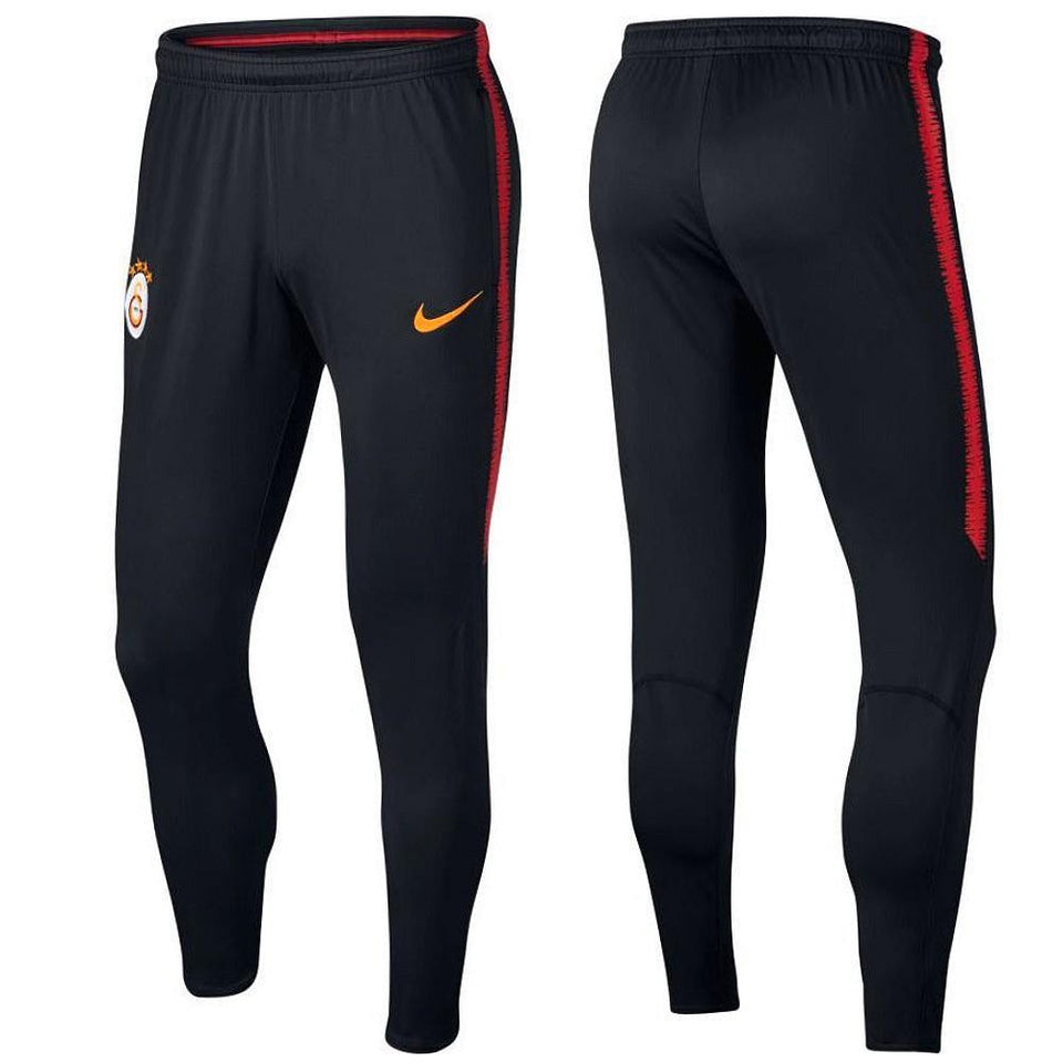 Galatasaray training pants in black with Nike logo and vibrant red accents for athletic performance
