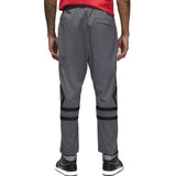 Back view of grey Jordan PSG presentation suit pants with black stripes and elastic waistband