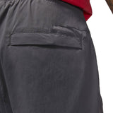 Close-up view of back pocket on grey Jordan PSG presentation suit pants by SoccerTracksuits.com