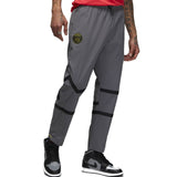 Grey Jordan PSG presentation suit pants with black stripes and PSG logo on left thigh