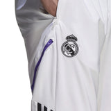 Real Madrid white presentation tracksuit 2022 featuring logo and zippered pockets for sports fans